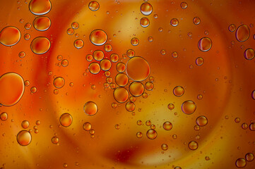 orange bubbles in a glass with drink