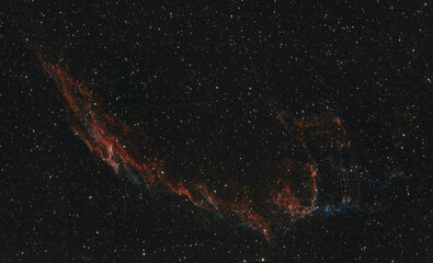 A nebula in space that looks like a face (Veil nebula)