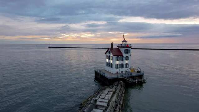 Lorain harbor light house in the middle of lake Erie, during twilight.