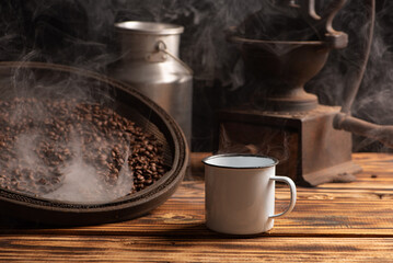 Coffee, white coffee mug on rustic wood and accessories, dark background, selective focus.