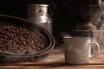 Coffee, white coffee mug on rustic wood and accessories, dark background, selective focus.