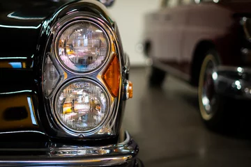 Foto auf Alu-Dibond Headlight of an oldtimer black car © ZenitX