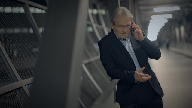 Grey Retired Mature Senior Businessman Talking Angry on Mobile Phone