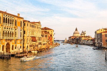 View of Grand Canal lined with historic architecture in Venice at sunset