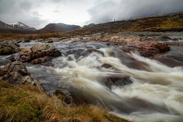 Slow shutter release of a fast flowing river in the highlands of Scotland