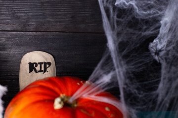 Fresh pumpkin with cobweb and decorations for Halloween