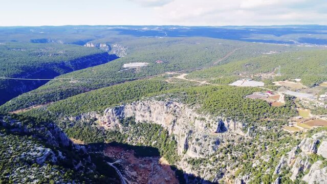 Experience drone flight high in mountains, capturing mountain panorama, forest rocks, and gorge canyon. Enjoy the mountain, aerial view, revealing stunning landscapes. Immerse in the mountain