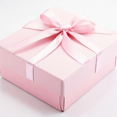 Small elegant gift box with a pink ribbon placed on a white surface