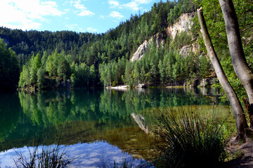 Obraz premium Rock city in Adrspach, Czech Republic. Quarry lake in Adrspach-Teplice Rocks Nature Park