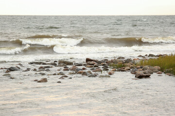 The sea splashes against the stones. The concept of sea rest, relaxation. Waves run onto the shore