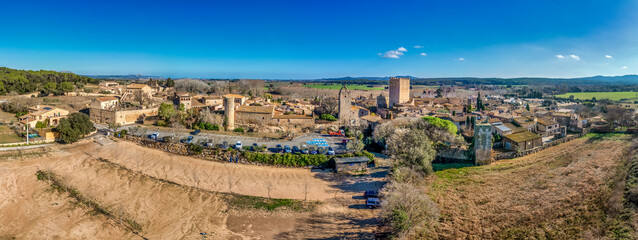 Aerial view of Peratallada, historic artistic small fortified medieval town with castle  in Catalonia, Spain near the Costa Brava. Stone buildings rutted stone streets and passageways.