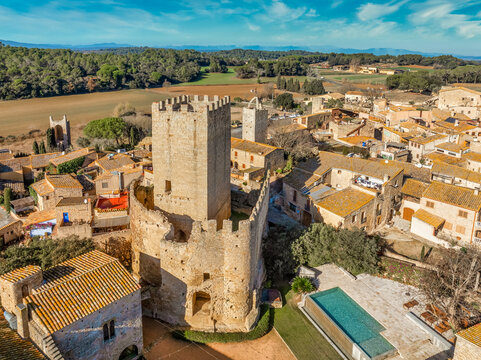 Aerial view of Peratallada, historic artistic small fortified medieval town with castle  in Catalonia, Spain near the Costa Brava. Stone buildings rutted stone streets and passageways.