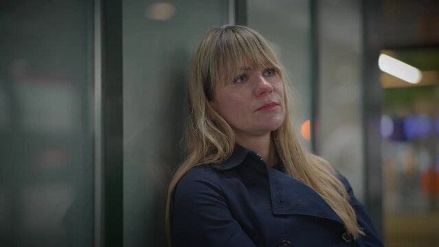 Sad Blond Woman Worried Thinking About Life Problems at Trainstation