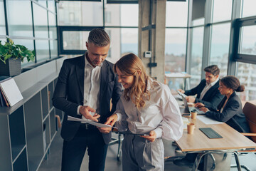 Two professional executives experts discussing financial accounting papers working together