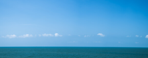 Fototapeta premium Panoramic beautiful blue sea on sky background