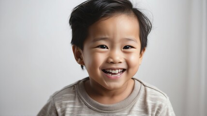 Little toddler asian boy laughing and looking at the camera on plain white background from Generative AI