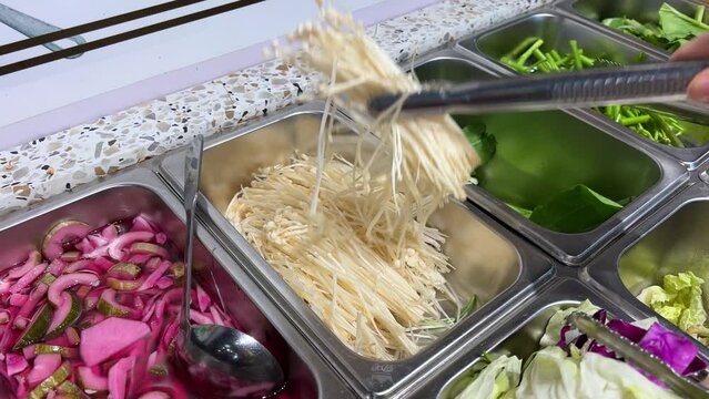 Korean foods served on a dining table. Perfect article, or any cooking contents. traditional hot pot combo, sweet garlic, and beef slices. It is very popular in sichuan
