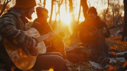 Friends group having fun moment at picnic playing guitar on sunset, friendship life style concept with young people enjoying springtime camping together at park 