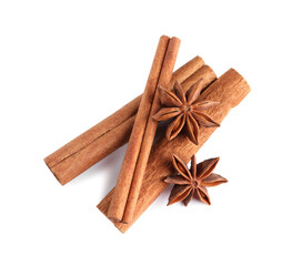 Cinnamon sticks and anise stars isolated on white, top view