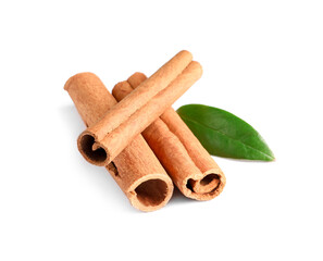 Cinnamon sticks and green leaf isolated on white