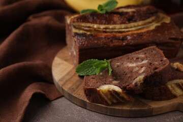 Delicious banana bread on brown table, closeup