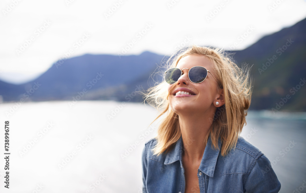 Poster Girl, smile and peace in nature for mountain as tourist in Cape Town to relax and sun. Female person, happiness and excited for adventure on excited in trip for holiday, lake and cheerful for hiking