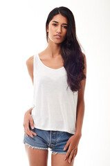 Fototapeta premium Fashion, portrait and confidence with Indian woman, stylish clothes and model isolated on a white studio background. Face, person and girl with streetwear and casual outfit with beauty and trendy