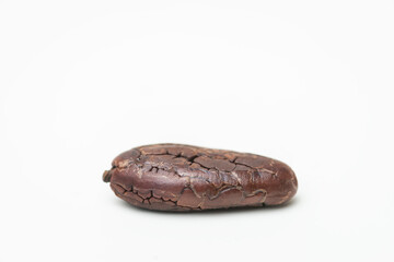 Single roasted cocoa bean chocolate isolated white background organic processed
