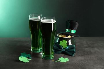 St. Patrick's day celebration. Green beer, leprechaun hat, pot of gold and decorative clover leaves...