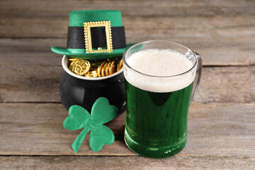 St. Patrick's day celebration. Green beer, leprechaun hat, pot of gold and decorative clover leaf...