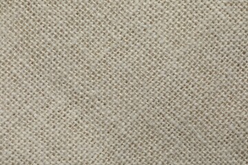 Texture of beige fabric as background, top view