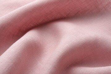 Texture of pink crumpled fabric as background, closeup