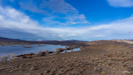Blue skies over Lahontan reservoir shore and water