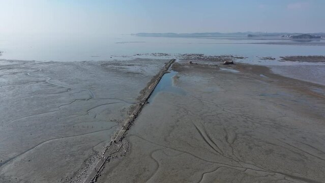 Beach scenery with mudflats visible
