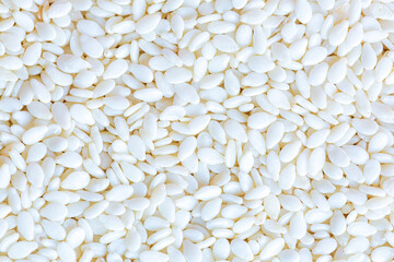 Close-up of white sesame seeds,Raw hulled white Sesame seeds, close-up.