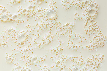 Macro soy milk background,macro soy milk texture,White soy milk bubble foam in cup on top view...