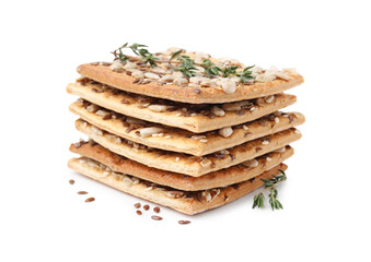 Stack of cereal crackers with flax, sunflower, sesame seeds and thyme isolated on white