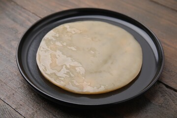 Making kombucha. Scoby fungus on wooden table, closeup