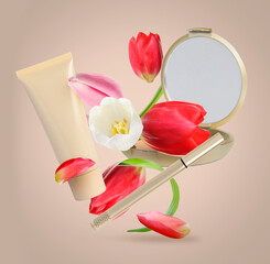 Spring flowers and makeup products in air on dark beige background