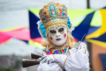 People wearing Venetian carnival-style masks are seen during the carnival in the city of...