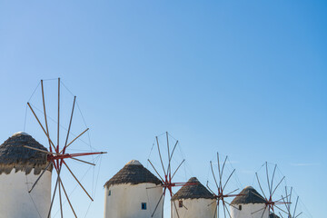 Partly seen Famous Windmills of Mykonos town with clear blue sky. Mykonos Island in Greece