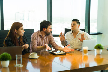 Serious business partners having a heated discussion in a meeting room