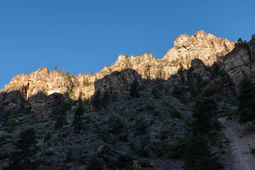 In a summer morning, cliffs viewed from the grizzly creek trail in the Glenwood Canyon, White River...