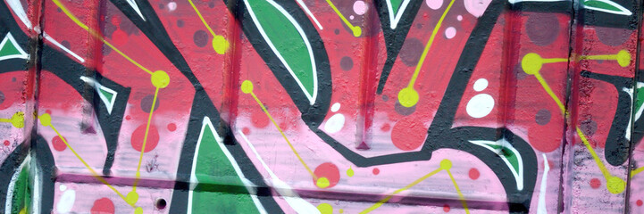 Colorful background of graffiti painting artwork with bright aerosol outlines on wall. Old school...