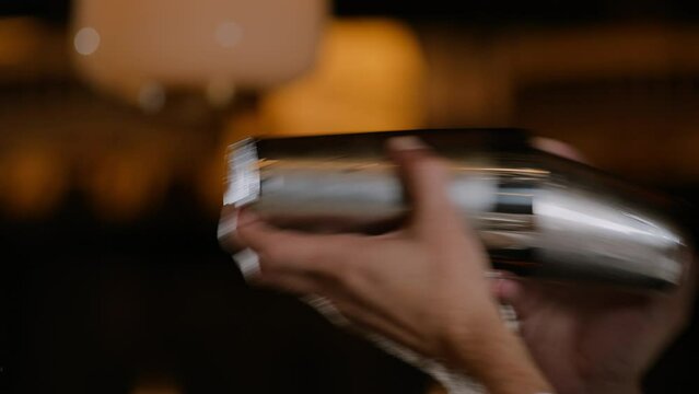 Bartender shaking a cocktail