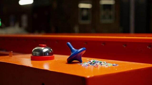 close-up toy and bell with recycled plastic at waste and garbage sorting station care for the environment