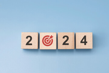 wood cube block with Return on investment in stocks, crypto coins in 2024, growing according to target