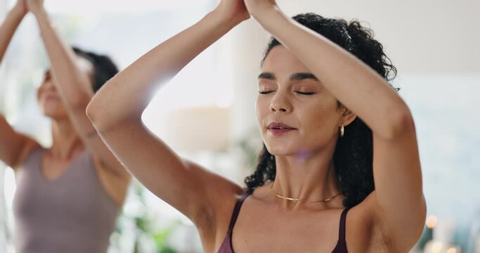 Woman, meditation and prayer hands in yoga for holistic wellness, zen and healing with breathing exercise. People with namaste, peace and palm together for mindfulness and mental health in class
