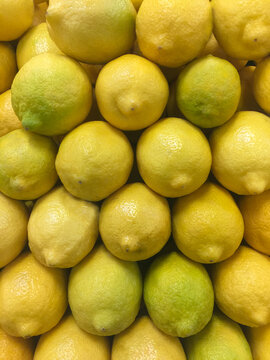 Fresh organic lemons on display at the market.