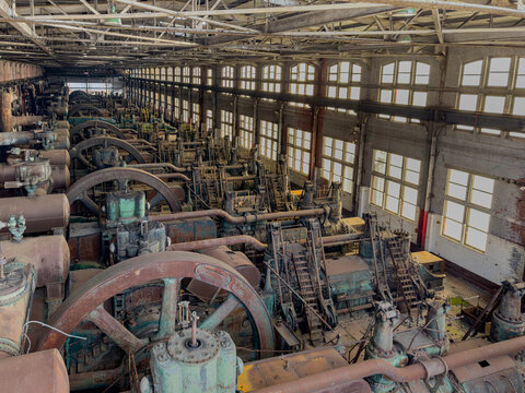 Interior image of the long factory floor with the heavy equipment and machinery used in the early 20th Century Steel Production at the Bethlehem Steel Works